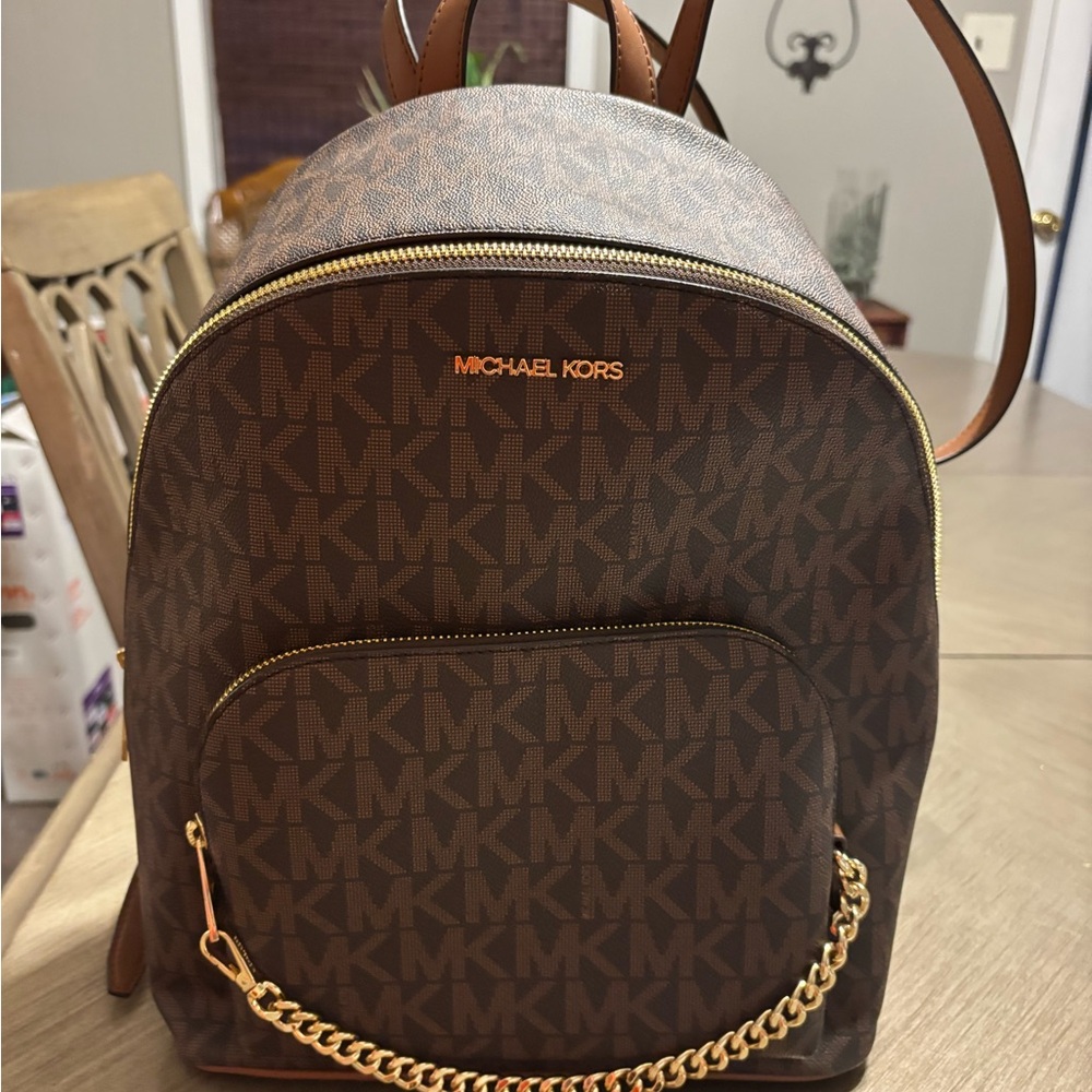 Michael Kors Brown Monogrammed Backpack with Gold Chain Detail